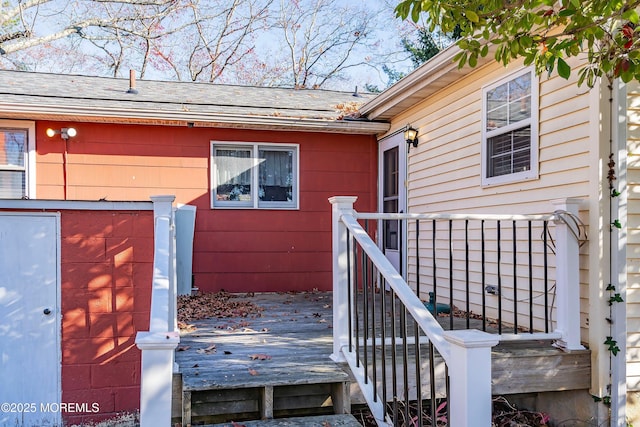 doorway to property featuring a wooden deck