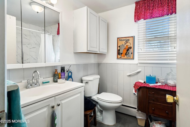 bathroom featuring vanity, a baseboard radiator, toilet, and walk in shower