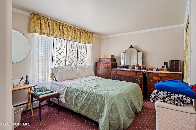 carpeted bedroom with ornamental molding and a baseboard heating unit