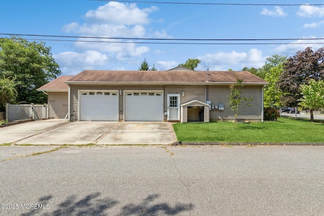 view of front facade with a garage and a front lawn