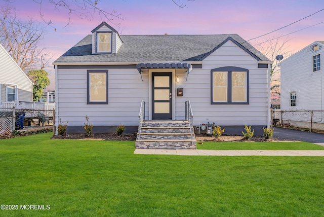 view of front of house with a yard