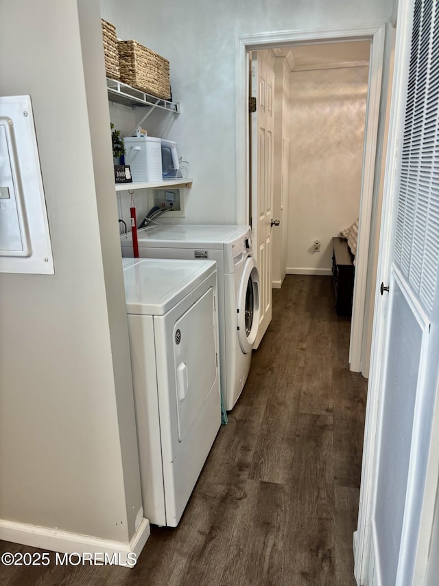 laundry area featuring separate washer and dryer, electric panel, and dark hardwood / wood-style floors