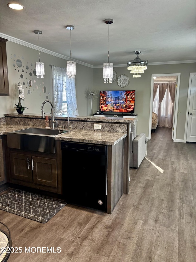 kitchen with hanging light fixtures, black dishwasher, ornamental molding, dark brown cabinets, and sink