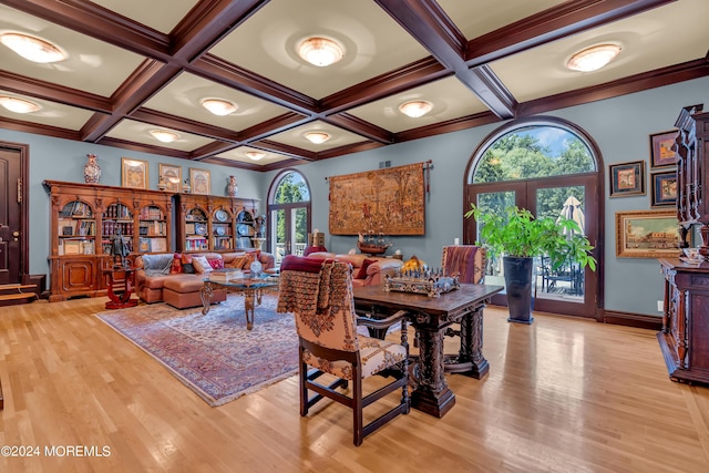 dining space featuring coffered ceiling, light hardwood / wood-style flooring, french doors, and ornamental molding