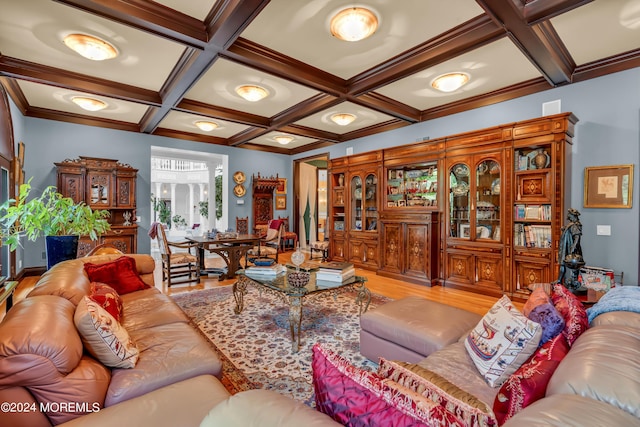 living room with beamed ceiling, wood-type flooring, crown molding, and coffered ceiling