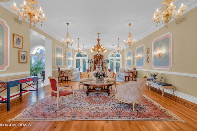 interior space featuring french doors, crown molding, and wood-type flooring