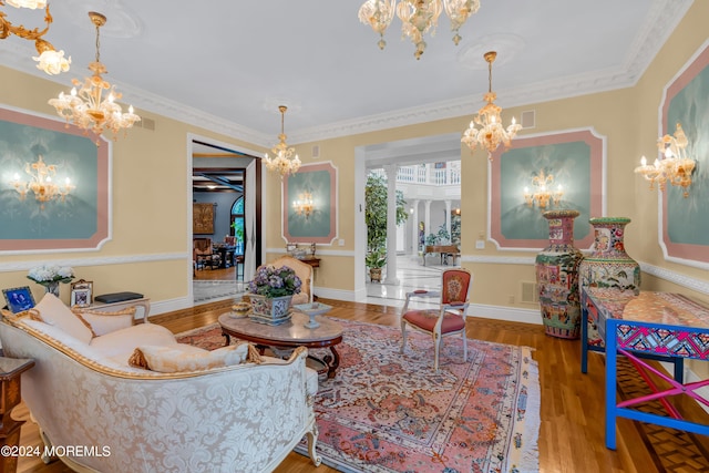 living room with crown molding and hardwood / wood-style flooring