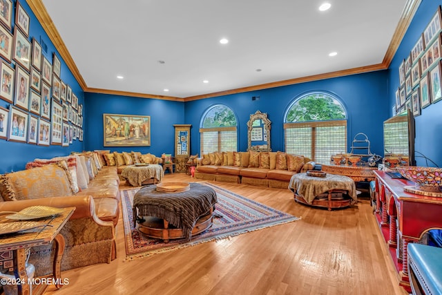 living room with hardwood / wood-style floors and ornamental molding