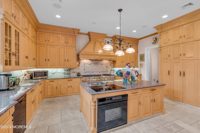 kitchen with premium range hood, black appliances, a center island with sink, hanging light fixtures, and tasteful backsplash