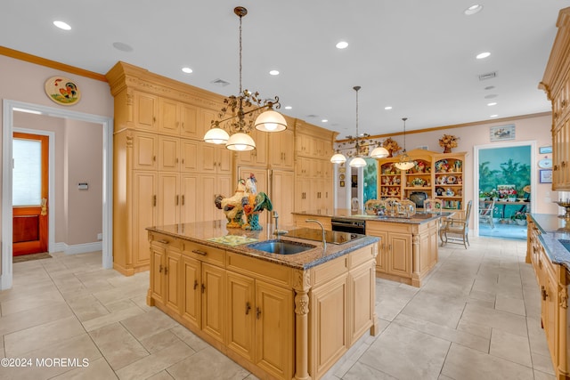 kitchen featuring ornamental molding, a center island with sink, pendant lighting, and sink