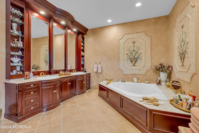 bathroom featuring tiled bath and vanity