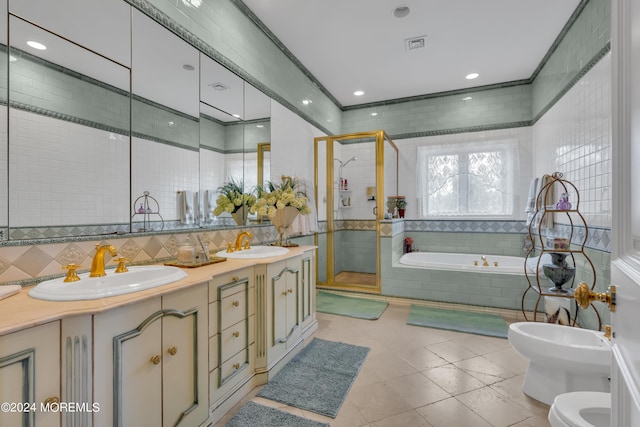 full bathroom with vanity, a bidet, tile patterned floors, toilet, and independent shower and bath