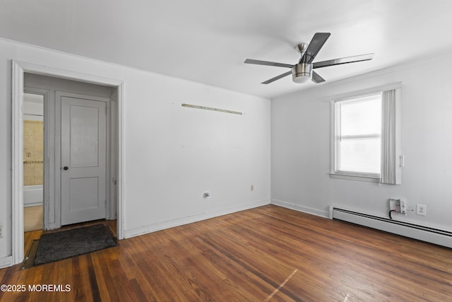 spare room with dark hardwood / wood-style floors, ceiling fan, and a baseboard radiator