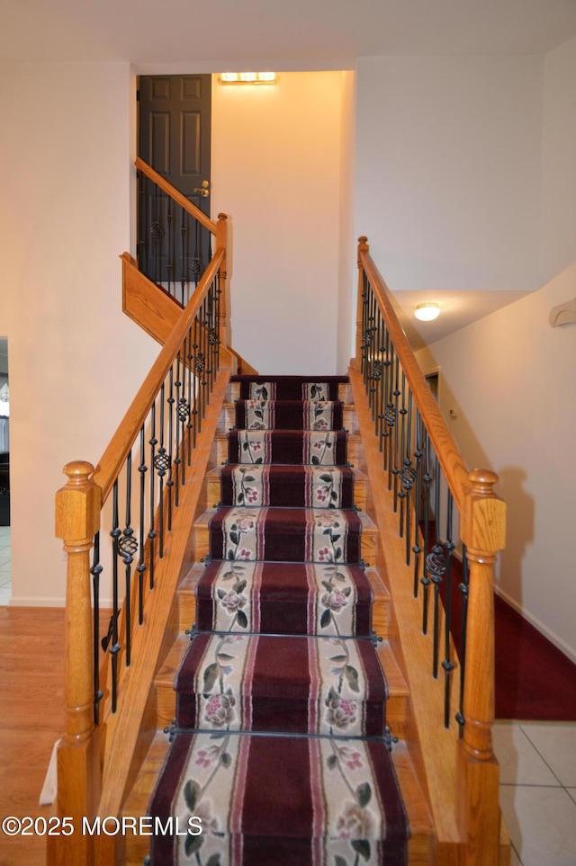 stairs with tile patterned flooring