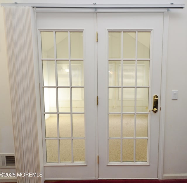 entryway featuring french doors