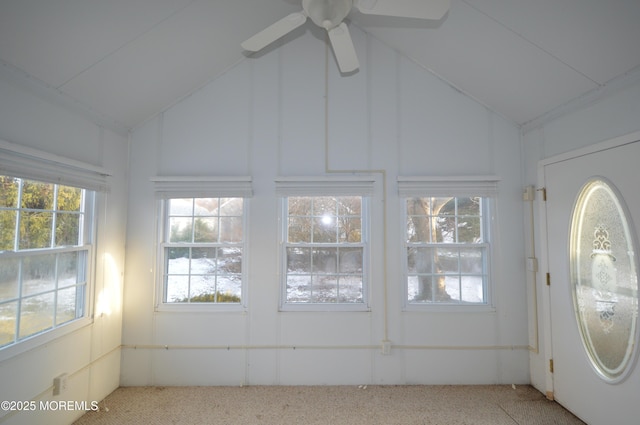 unfurnished sunroom featuring vaulted ceiling and ceiling fan