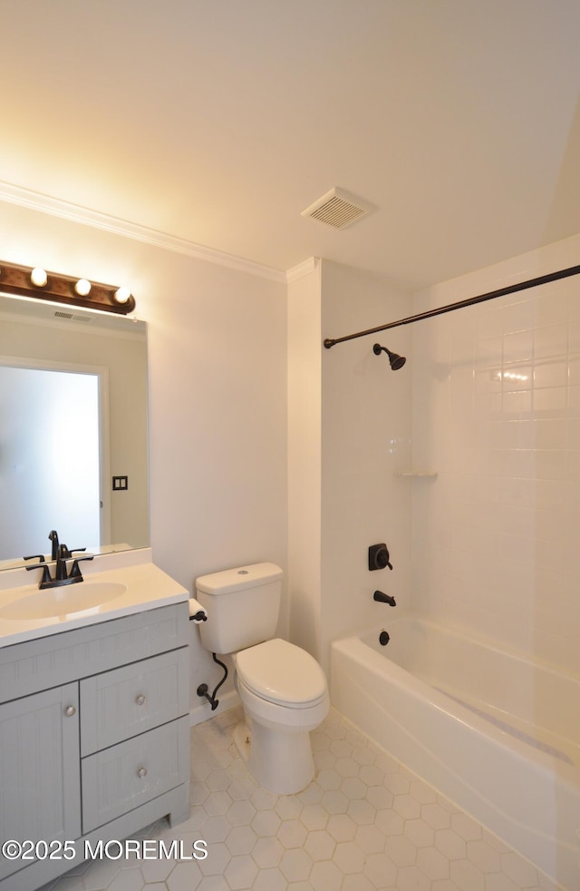 full bathroom with shower / bath combination, tile patterned floors, vanity, crown molding, and toilet