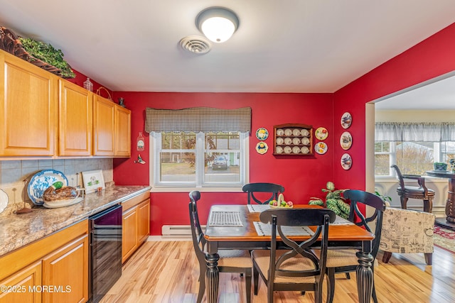 kitchen with a baseboard heating unit, light stone countertops, light wood-type flooring, tasteful backsplash, and beverage cooler