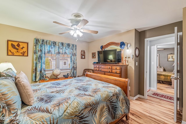 bedroom featuring light hardwood / wood-style floors and ceiling fan