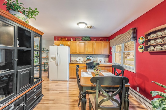 dining room featuring light hardwood / wood-style floors