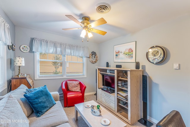 carpeted living room featuring ceiling fan