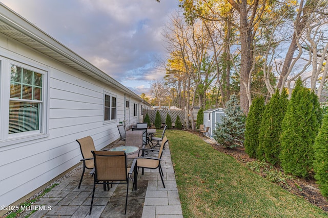 view of patio / terrace featuring a storage unit