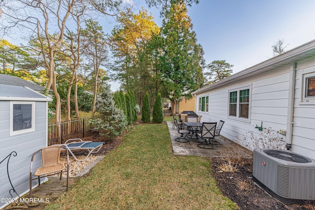 view of yard featuring cooling unit and a patio area