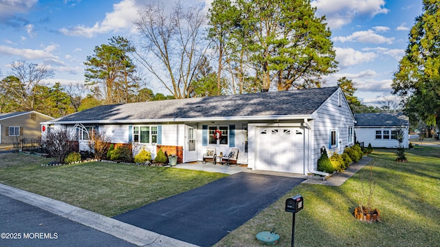 single story home with a front yard and a garage