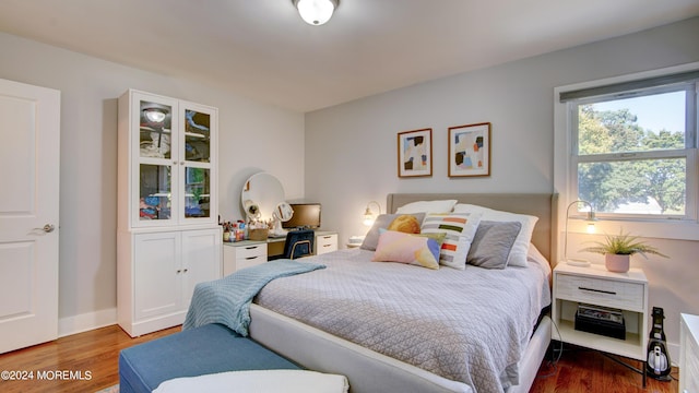 bedroom with hardwood / wood-style floors