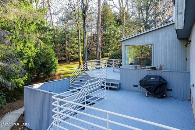 view of patio featuring a wooden deck and area for grilling