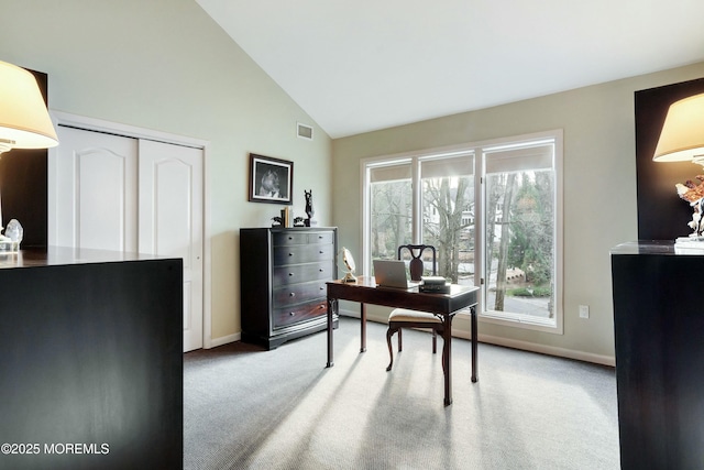 office area with carpet flooring, high vaulted ceiling, and a wealth of natural light