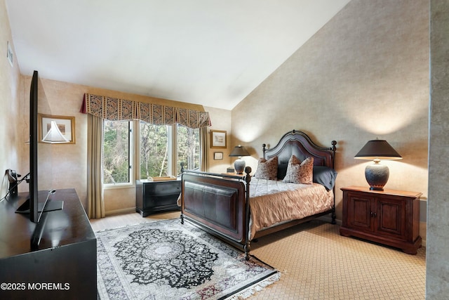 carpeted bedroom featuring lofted ceiling