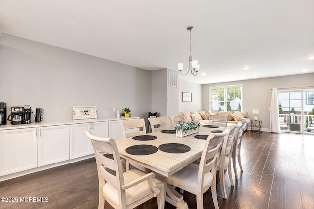 dining room with dark wood finished floors, recessed lighting, visible vents, a chandelier, and baseboards