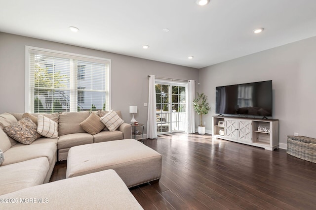 living room with baseboards, dark wood-type flooring, and recessed lighting