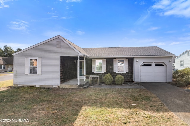 single story home with a front lawn and a garage