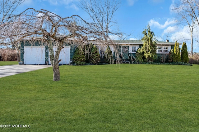 ranch-style home with a front yard and a garage