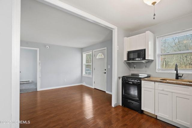 kitchen with black appliances, white cabinets, sink, and a baseboard radiator