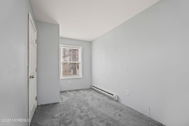 carpeted empty room featuring a baseboard radiator