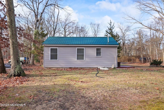 view of side of home featuring a yard