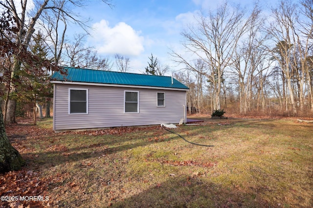 view of home's exterior featuring a yard