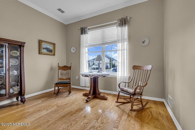 living area featuring light wood-type flooring and a wealth of natural light