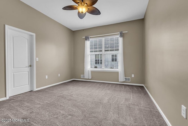 carpeted empty room with ceiling fan