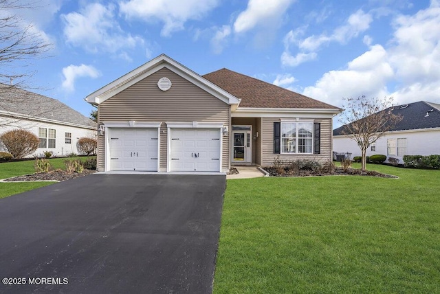 view of front facade featuring a front lawn and a garage