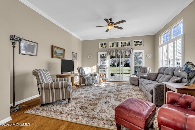 living room with ceiling fan, crown molding, and wood-type flooring