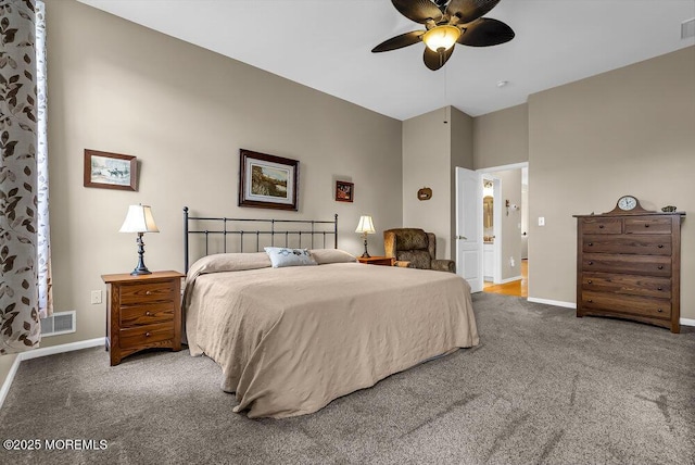 bedroom with carpet floors, ensuite bathroom, and ceiling fan