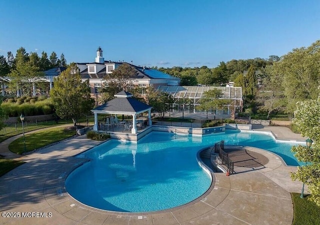 view of swimming pool with a gazebo and a patio