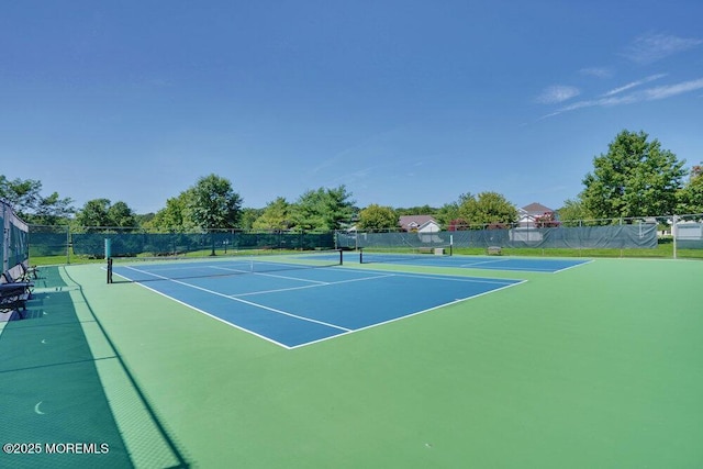 view of sport court featuring basketball hoop