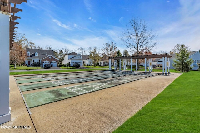 surrounding community with a lawn and a pergola