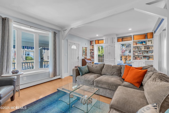 living room with built in shelves, light wood-type flooring, a baseboard heating unit, and crown molding