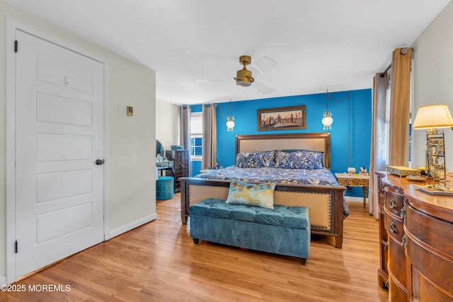 bedroom featuring ceiling fan and light hardwood / wood-style floors